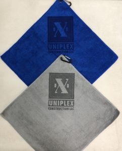 Assorted colors golf towels with laser etch logo under clip